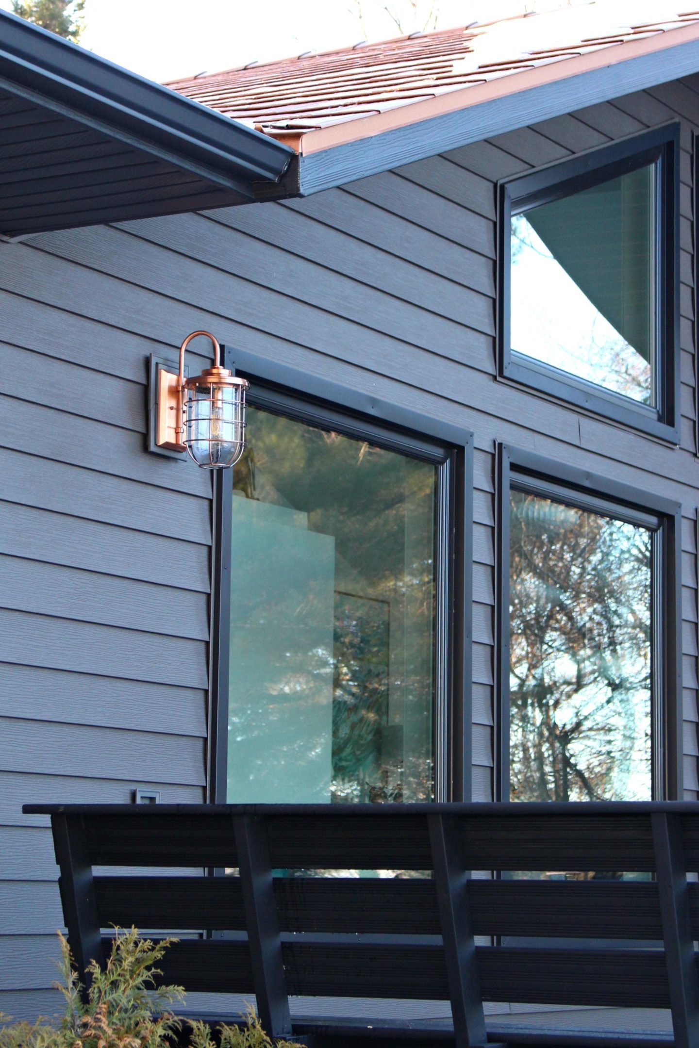 Copper Ferry Lights on Dark Grey Metal Siding with Copper Roof | Siding That Sparkles! 