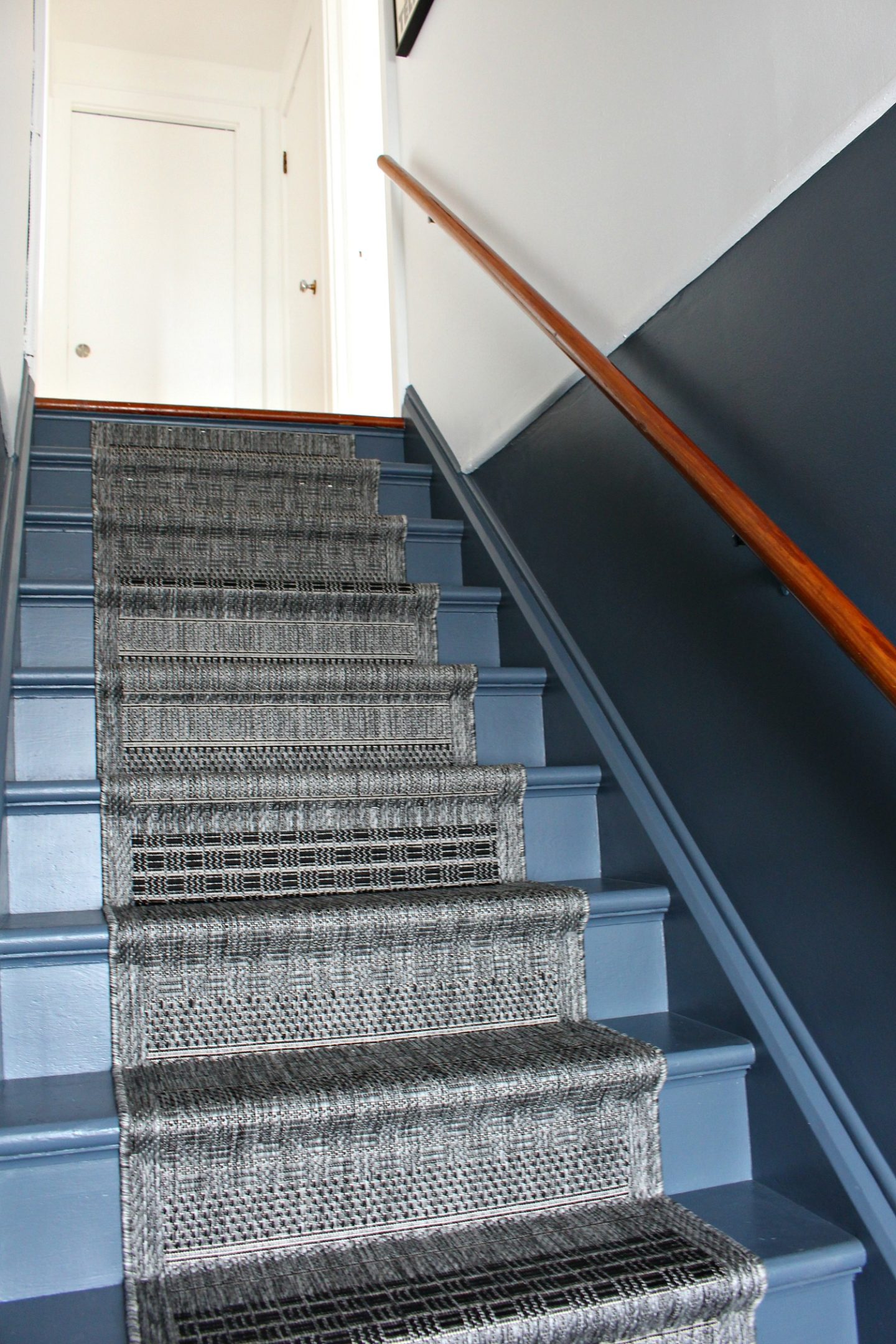 grey and white colorblocked stairs with DIY runner